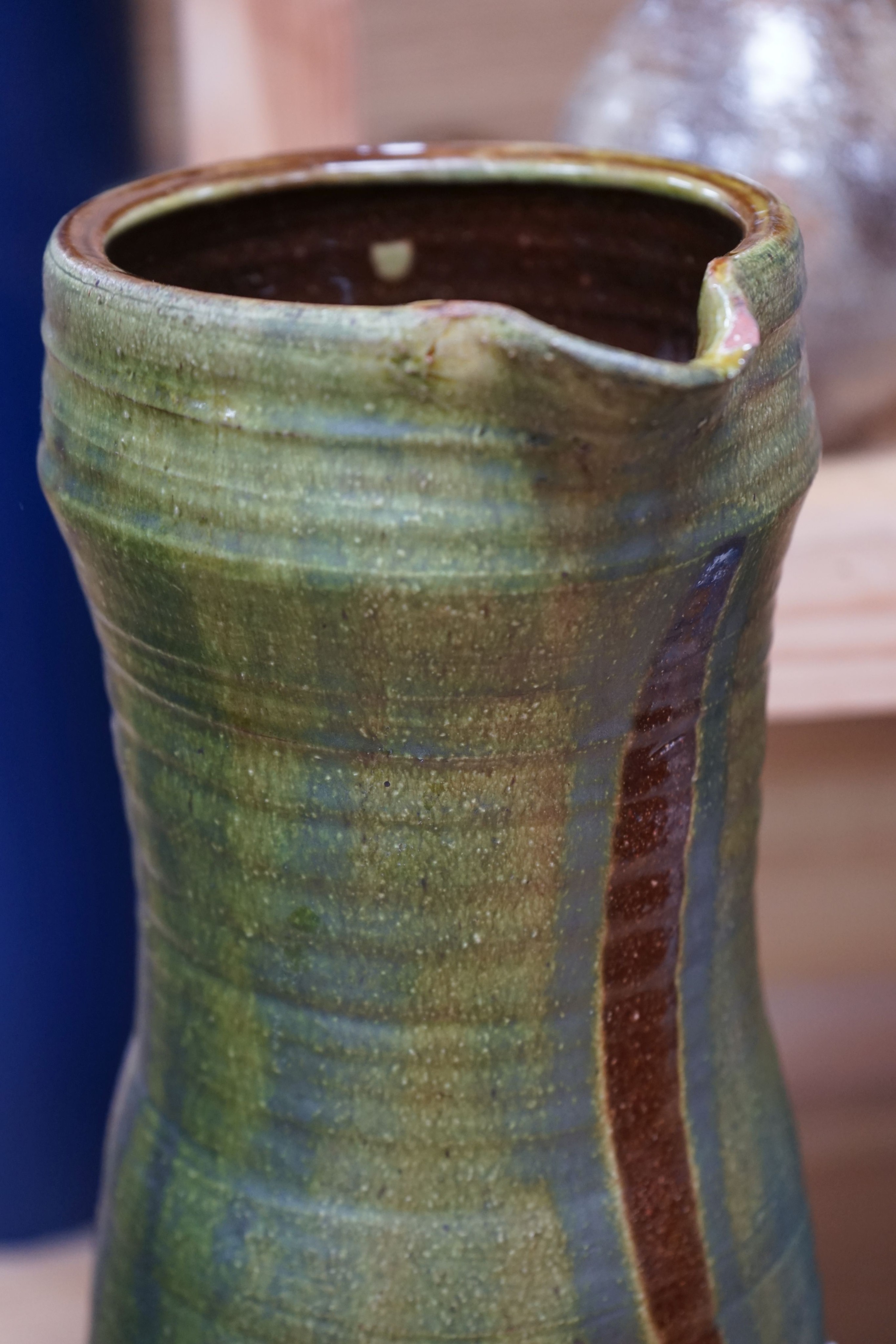 Clive Bowen (b.1943), a tall green glazed and brown slip decorated ewer, 59cm